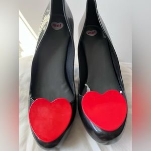 MEL rubber black high heels with cut out red heart on toe. Never worn.